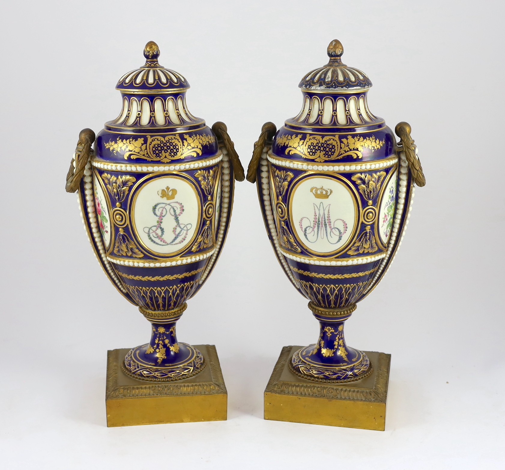 A pair of English porcelain Sevres style ormolu mounted vases and covers, mid 19th century, 44cm high, one replacement cover